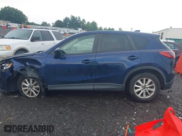 ✅ 2013 Mazda CX-5 Touring • VIN: JM3KE2CE1D0132257 • Lot: 42700625. Listed on IAAI with 87,796 mi. Free auction sales archive from the USA and detailed vehicle history report at DreamBid. Image 14.