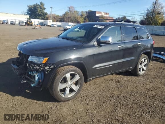 ✅ 2015 Jeep Grand Cherokee Overland • VIN: 1C4RJFCG0FC121411 • Lot: 89823465. Listed on Copart with 128,179 mi. Free auction sales archive from the USA and detailed vehicle history report at DreamBid. Image 1.