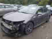 2021 Toyota Camry SE with VIN 4T1G11BK4MU028944, listed as a IAAI auction lot 43275174 with 82,954 mi miles and . Bid and sale history available at DreamBid. Image 2.