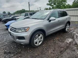 ✅ 2011 Volkswagen Touareg • VIN: WVGFG9BP3BD003163 • Лот: 63349305. Опубликован ранее на Copart с пробегом 140 532 миль. Бесплатный доступ к архиву аукционных продаж из США и подробный отчёт об истории автомобиля на DreamBid. Изображение 1.