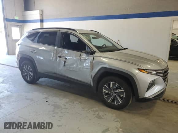 2023 Hyundai Tucson Blue z VIN KM8JBCA12PU091438, wystawiony jako Copart lot #57264655 z przebiegiem 72 768 mil mil oraz Szkoda całkowita • Salvage title. Historia ofert i sprzedaży dostępna na DreamBid. Obrazek 4.