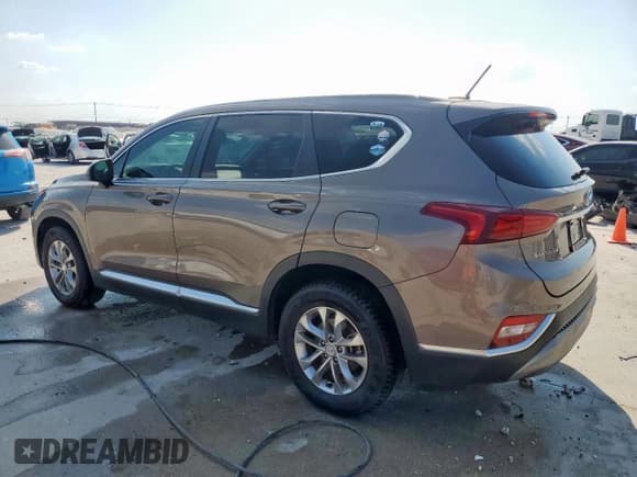 ✅ 2019 Hyundai Santa Fe SE • VIN: 5NMS23ADXKH097314 • Lot: 80940485. Listed on Copart with 114,759 mi. Free auction sales archive from the USA and detailed vehicle history report at DreamBid. Image 2.