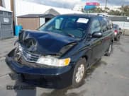 ✅ 2004 Honda Odyssey EX-L • VIN: 5FNRL18074B076928 • Lot: 43709130. Listed on IAAI with 206,633 mi. Free auction sales archive from the USA and detailed vehicle history report at DreamBid. Image 2.