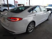 ✅ 2017 Ford Fusion Hybrid SE • VIN: 3FA6P0LU8HR315411 • Lot: 43804987. Listed on IAAI with 124,226 mi. Free auction sales archive from the USA and detailed vehicle history report at DreamBid. Image 4.