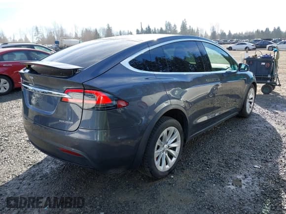 ✅ 2019 Tesla Model X P100D • VIN: 5YJXCBE44KF180391 • Lot: 41690866. Listed on IAAI with 57,863 mi. Free auction sales archive from the USA and detailed vehicle history report at DreamBid. Image 4.