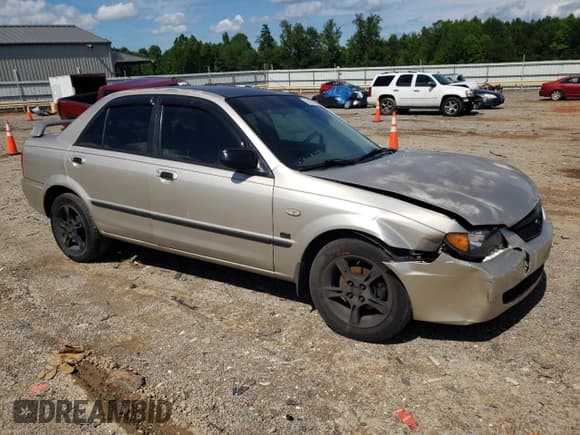 ✅ 2003 Mazda Protege DX • VIN: JM1BJ226730103729 • Lot: 63227285. Listed on Copart with 185,866 mi. Free auction sales archive from the USA and detailed vehicle history report at DreamBid. Image 4.