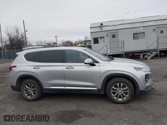 ✅ 2019 Hyundai Santa Fe SE • VIN: 5NMS2CAD7KH054274 • Lot: 43694931. Listed on IAAI with 96,329 mi. Free auction sales archive from the USA and detailed vehicle history report at DreamBid. Image 13.