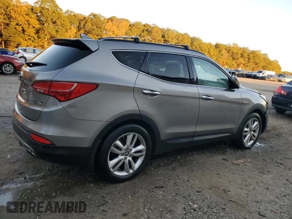 ✅ 2015 Hyundai Santa Fe • VIN: 5XYZWDLA7FG275479 • Lot: 91111245. Listed on Copart with 104,919 mi. Free auction sales archive from the USA and detailed vehicle history report at DreamBid. Image 3.