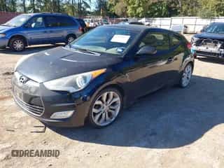 2013 Hyundai Veloster w/Black Int with VIN KMHTC6AD8DU152790, listed as a IAAI auction lot 43611817 with 205,910 mi miles and . Bid and sale history available at DreamBid. Image 2.