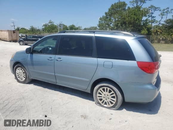 2009 Toyota Sienna LE with VIN 5TDBK23C89S028157, listed as a Copart auction lot 57068145 with 200,942 mi miles and Clean title. Bid and sale history available at DreamBid. Image 2.
