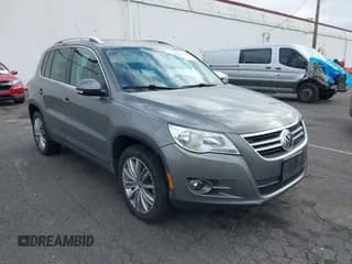 ✅ 2011 Volkswagen Tiguan S • VIN: WVGBV7AX1BW537860 • Lot: 43047660. Listed on IAAI with 93,764 mi. Free auction sales archive from the USA and detailed vehicle history report at DreamBid. Image 1.