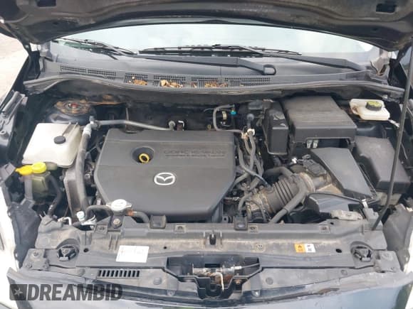 ✅ 2013 Mazda 5 Sport • VIN: JM1CW2BL5D0148214 • Лот: 42936674. Опубликован ранее на IAAI с пробегом 206 957 миль. Бесплатный доступ к архиву аукционных продаж из США и подробный отчёт об истории автомобиля на DreamBid. Изображение 10.