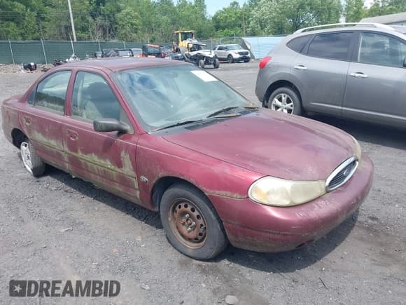 ✅ 1999 Ford Contour SE • VIN: 1FAFP6634XK138445 • Lot: 42835260. Listed on IAAI with 126,100 mi. Free auction sales archive from the USA and detailed vehicle history report at DreamBid. Image 1.