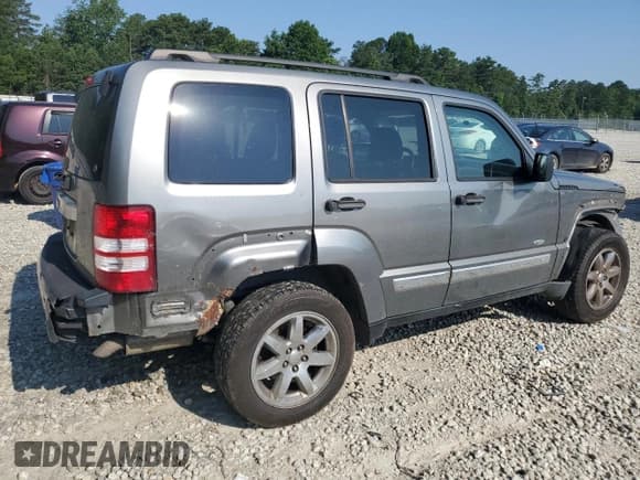 ✅ 2012 Jeep Liberty Sport Latitude • VIN: 1C4PJLAK0CW180157 • Lot: 60892905. Listed on Copart with 253,827 mi. Free auction sales archive from the USA and detailed vehicle history report at DreamBid. Image 3.