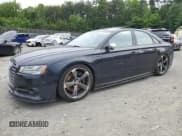 ✅ 2015 Audi S8 • VIN: WAUK2AFD5FN004203 • Lot: 58317975. Listed on Copart with 142,824 mi. Free auction sales archive from the USA and detailed vehicle history report at DreamBid. Image 1.