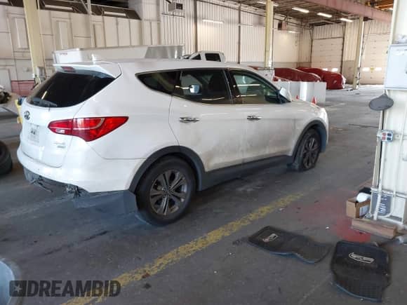 2015 Hyundai Santa Fe z VIN 5XYZTDLB4FG294735, wystawiony jako IAAI lot #43230960 z przebiegiem 169 342 mil mil oraz . Historia ofert i sprzedaży dostępna na DreamBid. Obrazek 4.