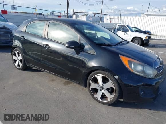 ✅ 2013 Kia Rio EX • VIN: KNADN5A31D6136842 • Lot: 43757042. Listed on IAAI with 107,054 mi. Free auction sales archive from the USA and detailed vehicle history report at DreamBid. Image 1.