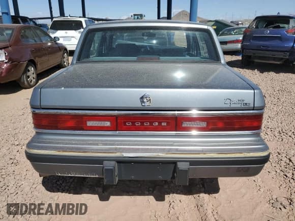 ✅ 1991 Dodge Dynasty LE • VIN: 1B3XC56R9MD115785 • Lot: 48073715. Listed on Copart with 64,483 mi. Free auction sales archive from the USA and detailed vehicle history report at DreamBid. Image 6.