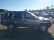 ✅ 1999 Jeep Grand Cherokee Laredo • VIN: 1J4GW58S1XC520727 • Lot: 43730318. Wystawiony na IAAI z przebiegiem 154 356 mil. Bezpłatny archiwum sprzedaży aukcyjnych z USA i szczegółowy raport historii pojazdu na DreamBid. Zdjęcie 13.