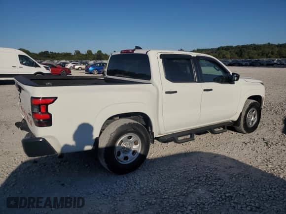 2023 Nissan Frontier SV with VIN 1N6ED1EKXPN633870, listed as a Copart auction lot 82396855 with 23,931 mi miles and Salvage title. Bid and sale history available at DreamBid. Image 3.