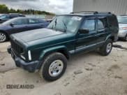 ✅ 2000 Jeep Cherokee • VIN: 1J4FF48S4YL113217 • Lot: 86477395. Listed on Copart with 153,937 mi. Free auction sales archive from the USA and detailed vehicle history report at DreamBid. Image 1.