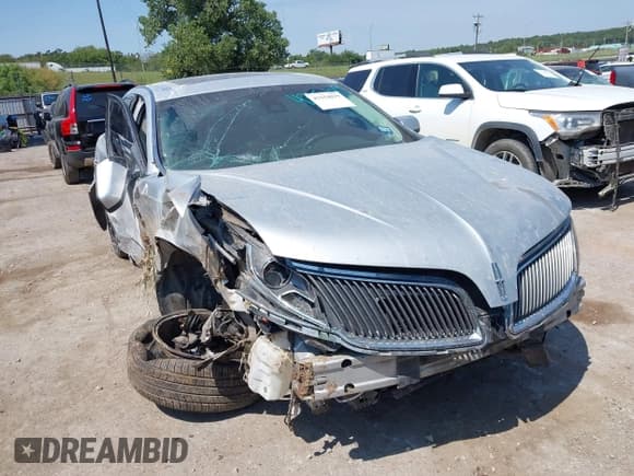 ✅ 2015 Lincoln MKS • VIN: 1LNHL9DK8FG608211 • Lot: 43154019. Listed on IAAI with 152,341 mi. Free auction sales archive from the USA and detailed vehicle history report at DreamBid. Image 1.