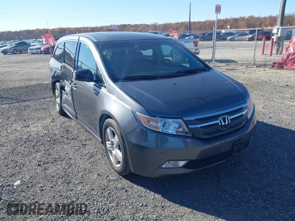 ✅ 2012 Honda Odyssey Touring • VIN: 5FNRL5H96CB103962 • Lot: 43587214. Listed on IAAI with 169,916 mi. Free auction sales archive from the USA and detailed vehicle history report at DreamBid. Image 1.