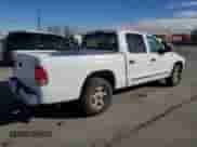 2002 Dodge Dakota SLT с VIN 1B7HL48XX2S523231, выставлен на аукционе Copart как лот 79940644 с пробегом 125 728 миль миль и Списание • Salvage title. История ставок и продаж доступна на DreamBid. Изображение 3.