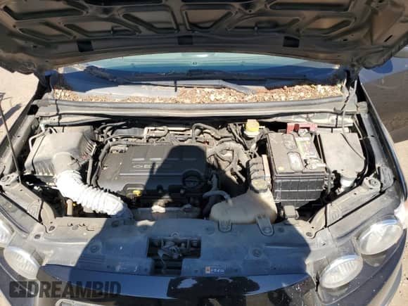 2012 Chevrolet Sonic LT z VIN 1G1JC5SB6C4222278, wystawiony jako Copart lot #57499805 z przebiegiem 151 199 mil mil oraz Nie do naprawy • Non repairable. Historia ofert i sprzedaży dostępna na DreamBid. Obrazek 11.