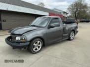 ✅ 2003 Ford F-150 Lightning • VIN: 2FTRF073X3CA56501 • Lot: 42083560. Listed on IAAI with 112,754 mi. Free auction sales archive from the USA and detailed vehicle history report at DreamBid. Image 2.