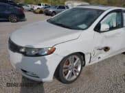 ✅ 2013 Kia Forte SX • VIN: KNAFW5A30D5668904 • Лот: 43441495. Опубликован ранее на IAAI с пробегом 124 026 миль. Бесплатный доступ к архиву аукционных продаж из США и подробный отчёт об истории автомобиля на DreamBid. Изображение 6.