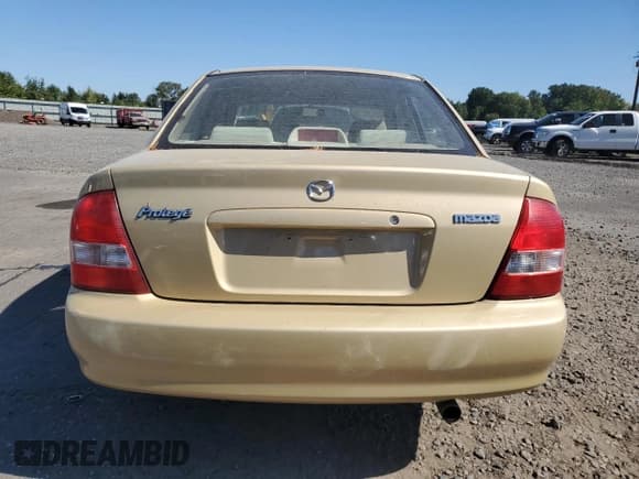 ✅ 2003 Mazda Protege DX • VIN: JM1BJ225631193019 • Lot: 81088365. Listed on Copart with 128,031 mi. Free auction sales archive from the USA and detailed vehicle history report at DreamBid. Image 6.