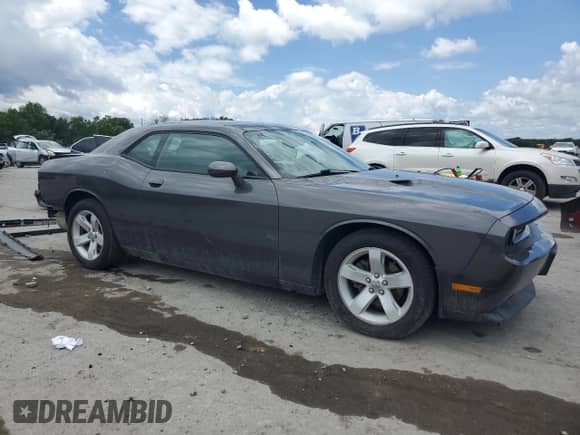 2014 Dodge Challenger SXT 100th Anniversary with VIN 2C3CDYAG6EH294961, listed as a Copart auction lot 58790705 with 184,498 mi miles and Salvage title. Bid and sale history available at DreamBid. Image 4.
