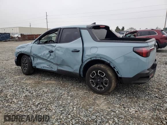 2024 Hyundai Santa Cruz SEL z VIN 5NTJBDDE3RH101529, wystawiony jako Copart lot #79864154 z przebiegiem 2 272 mil mil oraz Szkoda całkowita • Salvage title. Historia ofert i sprzedaży dostępna na DreamBid. Obrazek 2.