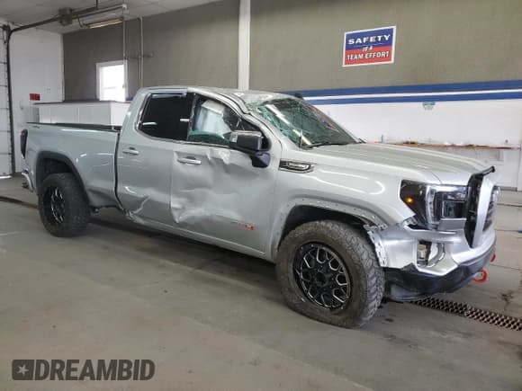 ✅ 2021 GMC Sierra 1500 SLE • VIN: 1GTR9BED8MZ236210 • Лот: 56898185. Опубликован ранее на Copart с пробегом 128 697 миль. Бесплатный доступ к архиву аукционных продаж из США и подробный отчёт об истории автомобиля на DreamBid. Изображение 4.