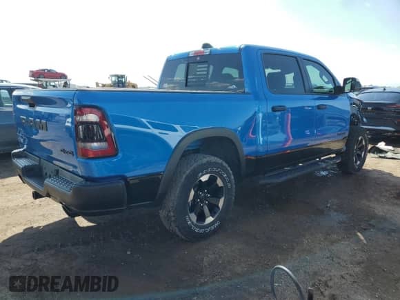 2021 Ram 1500 Rebel with VIN 1C6SRFLT9MN831925, listed as a Copart auction lot 83924035 with 85,885 mi miles and Salvage title. Bid and sale history available at DreamBid. Image 3.