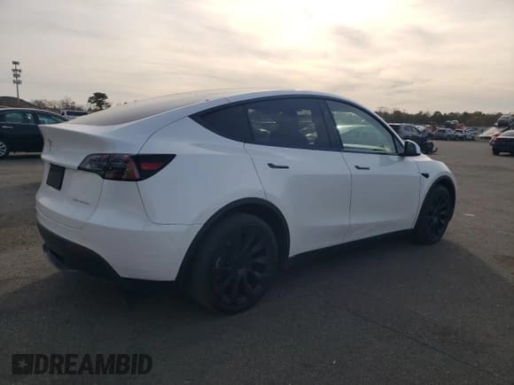 ✅ 2023 Tesla Model Y Long Range • VIN: 7SAYGDEE1PF827997 • Лот: 90992585. Опубликован ранее на Copart с пробегом 32 162 миль. Бесплатный доступ к архиву аукционных продаж из США и подробный отчёт об истории автомобиля на DreamBid. Изображение 3.