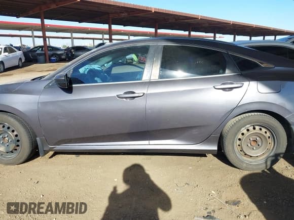 ✅ 2017 Honda Civic LX • VIN: 19XFC2F54HE041105 • Lot: 43595218. Listed on IAAI with 124,866 mi. Free auction sales archive from the USA and detailed vehicle history report at DreamBid. Image 14.