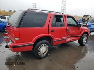 ✅ 1998 GMC Jimmy SLE • VIN: 1GKDT13W1W2508350 • Лот: 77904394. Опубликован ранее на Copart с пробегом 175 000 миль. Бесплатный доступ к архиву аукционных продаж из США и подробный отчёт об истории автомобиля на DreamBid. Изображение 3.