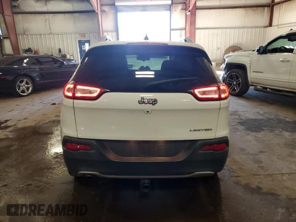 ✅ 2016 Jeep Cherokee Limited • VIN: 1C4PJLDB0GW216303 • Lot: 82265635. Listed on Copart with 131,659 mi. Free auction sales archive from the USA and detailed vehicle history report at DreamBid. Image 6.