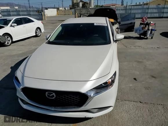 ✅ 2021 Mazda 3 S • VIN: JM1BPAAL8M1331668 • Lot: 82009625. Listed on Copart with 87,747 mi. Free auction sales archive from the USA and detailed vehicle history report at DreamBid. Image 14.