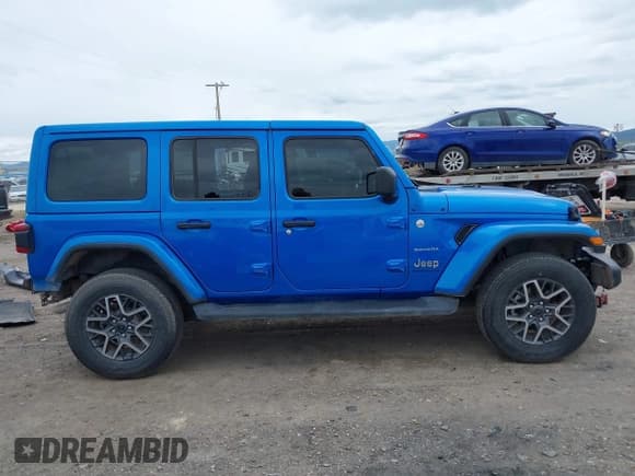 ✅ 2024 Jeep Wrangler Sahara • VIN: 1C4PJXEG0RW344058 • Lot: 42261013. Listed on IAAI with 20,040 mi. Free auction sales archive from the USA and detailed vehicle history report at DreamBid. Image 14.