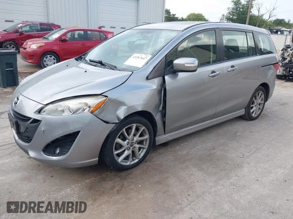 ✅ 2014 Mazda 5 Touring • VIN: JM1CW2CL7E0175902 • Lot: 43287647. Listed on IAAI with 98,037 mi. Free auction sales archive from the USA and detailed vehicle history report at DreamBid. Image 17.