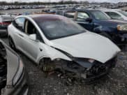 ✅ 2017 Tesla Model X 90D • VIN: 5YJXCAE21HF040252 • Lot: 72074132. Listed on Copart with 60,842 mi. Free auction sales archive from the USA and detailed vehicle history report at DreamBid. Image 4.