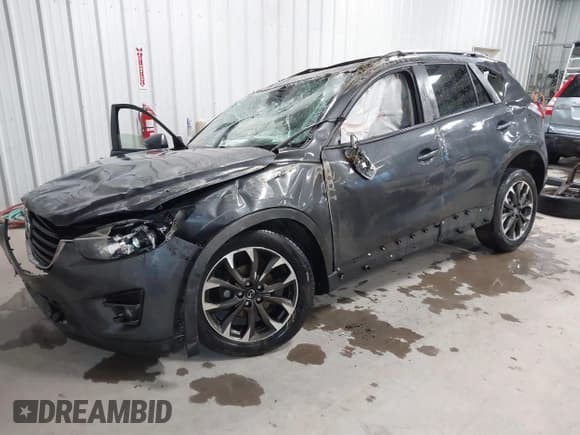 ✅ 2016 Mazda CX-5 Grand Touring • VIN: JM3KE4DY4G0679077 • Lot: 43560857. Wystawiony na IAAI z przebiegiem 83 348 mil. Bezpłatny archiwum sprzedaży aukcyjnych z USA i szczegółowy raport historii pojazdu na DreamBid. Zdjęcie 18.