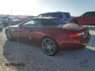 ✅ 2013 Jaguar XK • VIN: SAJWA4GB9DLB51059 • Лот: 77322014. Опубликован ранее на Copart с пробегом Не указан. Бесплатный доступ к архиву аукционных продаж из США и подробный отчёт об истории автомобиля на DreamBid. Изображение 2.