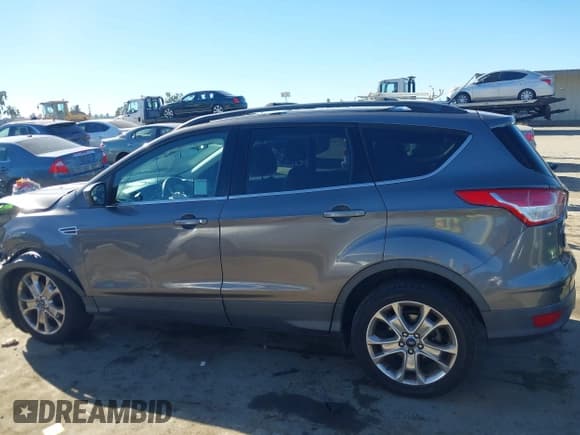 ✅ 2013 Ford Escape SE • VIN: 1FMCU9G97DUD10571 • Lot: 43798281. Listed on IAAI with 156,022 mi. Free auction sales archive from the USA and detailed vehicle history report at DreamBid. Image 14.
