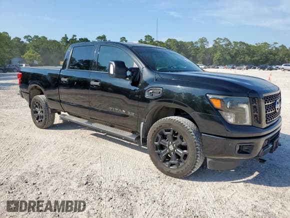 ✅ 2018 Nissan Titan Platinum Reserve • VIN: 1N6BA1F43JN525223 • Lot: 67204495. Listed on Copart with 112,352 mi. Free auction sales archive from the USA and detailed vehicle history report at DreamBid. Image 4.