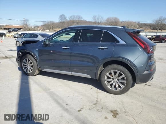 ✅ 2021 Cadillac XT4 AWD Premium Luxury • VIN: 1GYFZDR47MF002175 • Лот: 48303665. Опубликован ранее на Copart с пробегом 94 698 миль. Бесплатный доступ к архиву аукционных продаж из США и подробный отчёт об истории автомобиля на DreamBid. Изображение 2.