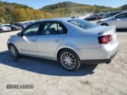 ✅ 2009 Volkswagen Jetta Wolfsburg Edition • VIN: 3VWRJ71K09M035707 • Лот: 76350494. Опубликован ранее на Copart с пробегом 150 888 миль. Бесплатный доступ к архиву аукционных продаж из США и подробный отчёт об истории автомобиля на DreamBid. Изображение 2.
